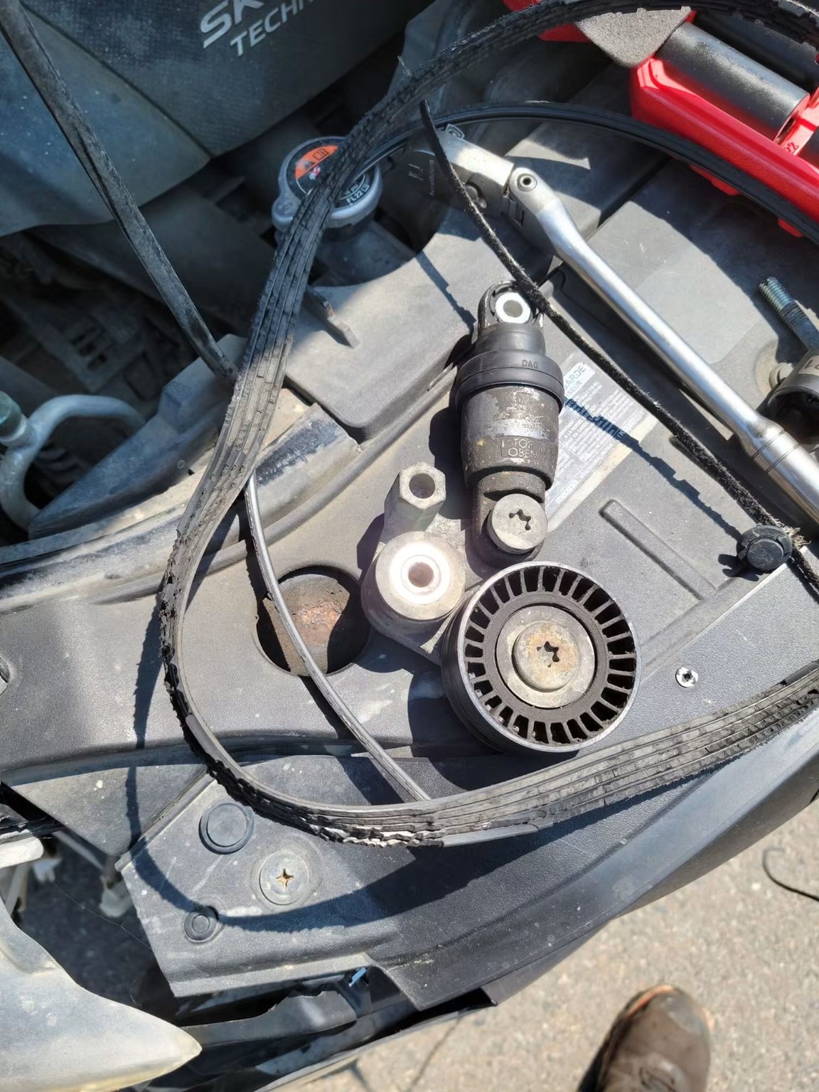 Automotive belt and tensioner repair